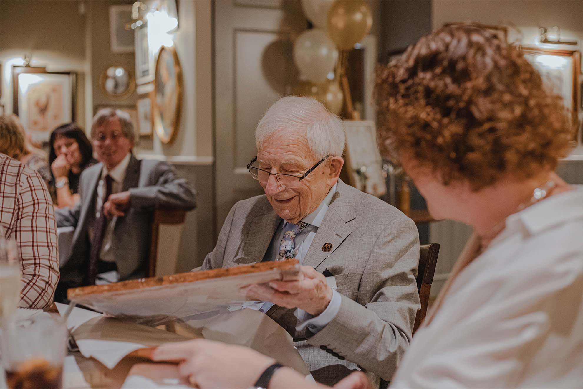male resident celebrating his birthday in a private dining room with loved ones